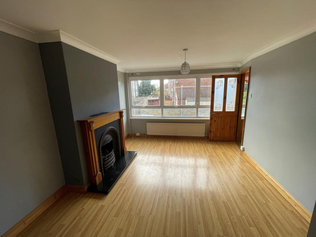 Lot: 43 - THREE-BEDROOM TERRACE HOUSE - Living room with fireplace